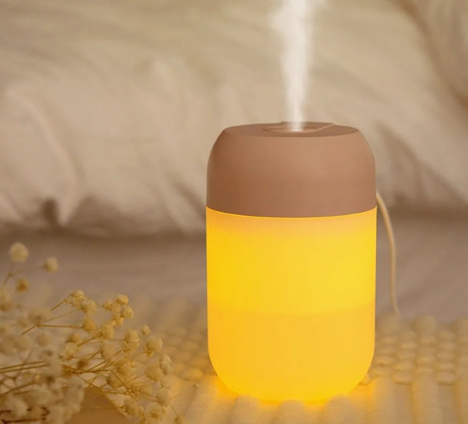 Small white cylindrical USB-powered humidifier with aromatherapy function