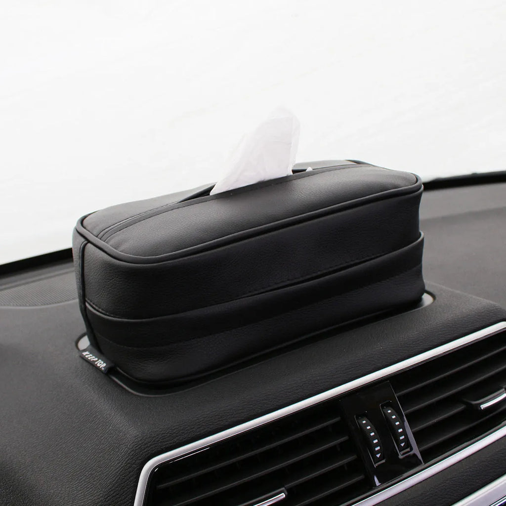 Black PU leather hanging storage box with paper bag liner, shown suspended.