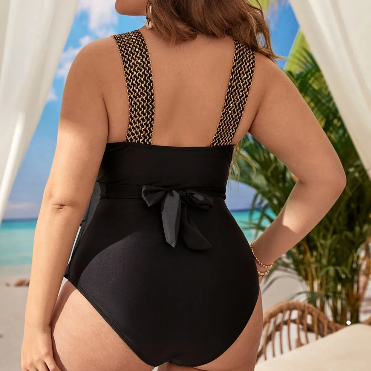 Women's black one-piece plus size swimsuit with chest pad on a mannequin