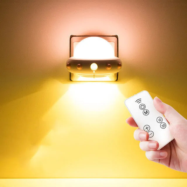 Remote control UFO-shaped bedside night light in blue, pink, or white with LED lighting