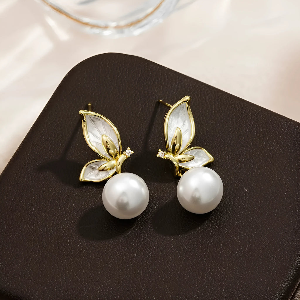 A pair of women's butterfly earrings in colour PT0203, made from copper with zircon painting.