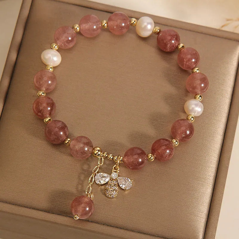 Women's strawberry quartz and freshwater pearl bracelet with zircon details and alloy charms