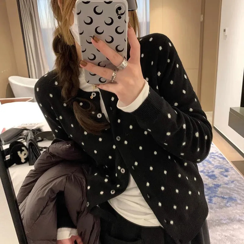 Women's grey dot knitted cardigan with crocheted flower detail and long sleeves