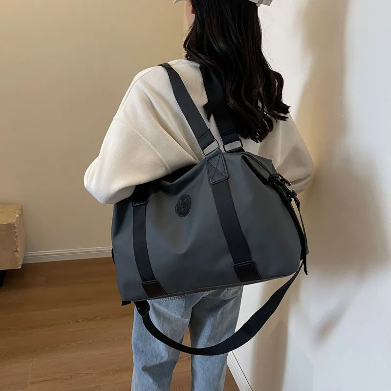 Large black travel rucksack made from Oxford cloth with breathable back padding and multiple compartments.