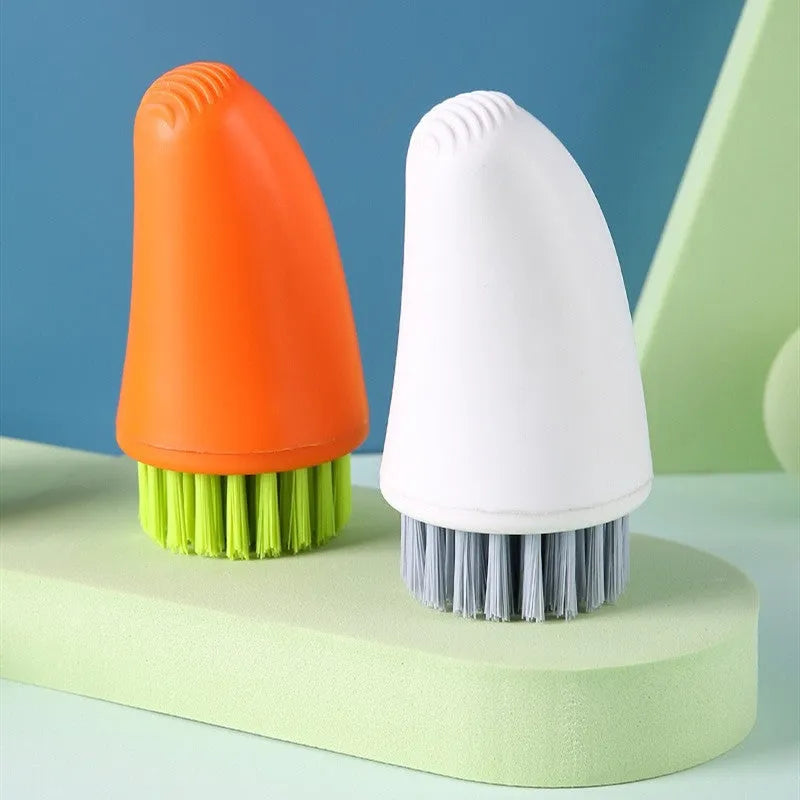 Orange and white radish-shaped nylon carrot cleaning brush for vegetables.