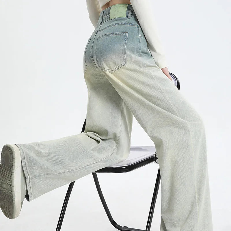 Women's gradient blue straight-leg denim trousers showing wider cut through thigh and calf