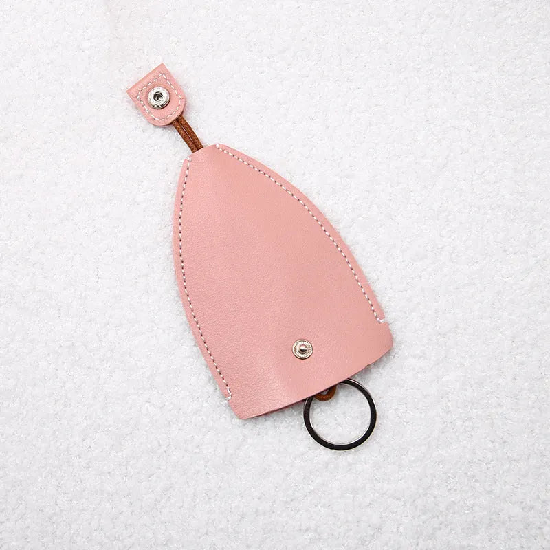 Colourful cartoon pull-out key protector case made from PU leather, showing a selection of fruit and animal designs.