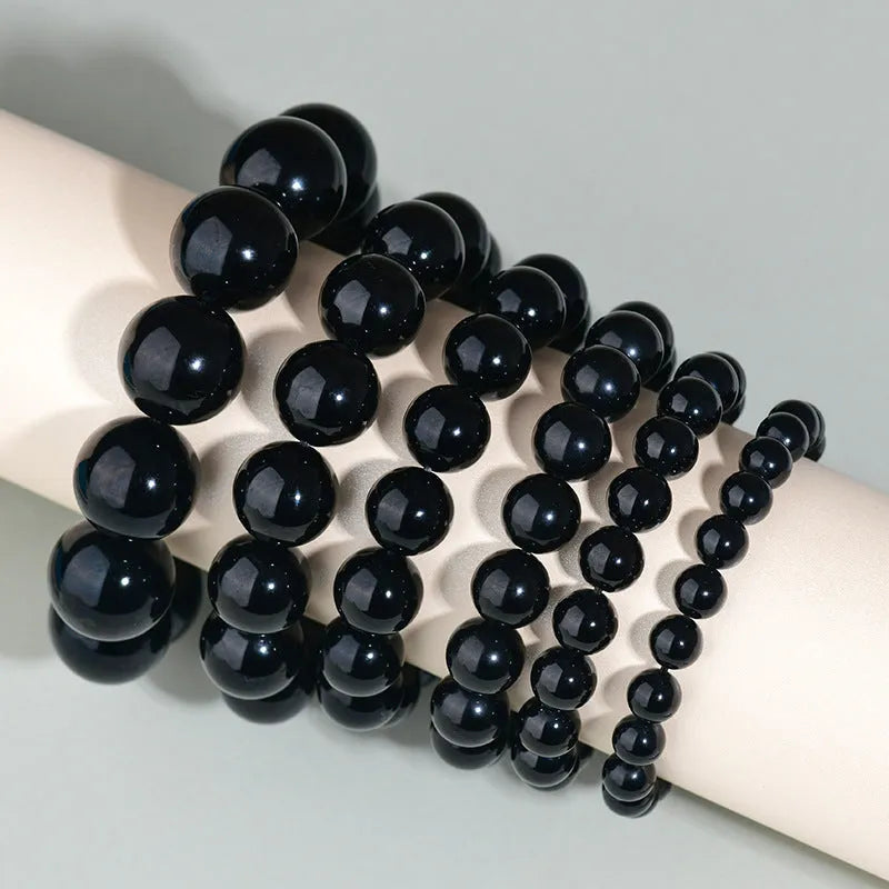 Hand-woven obsidian crystal bracelet with round beads in ethnic style unisex design