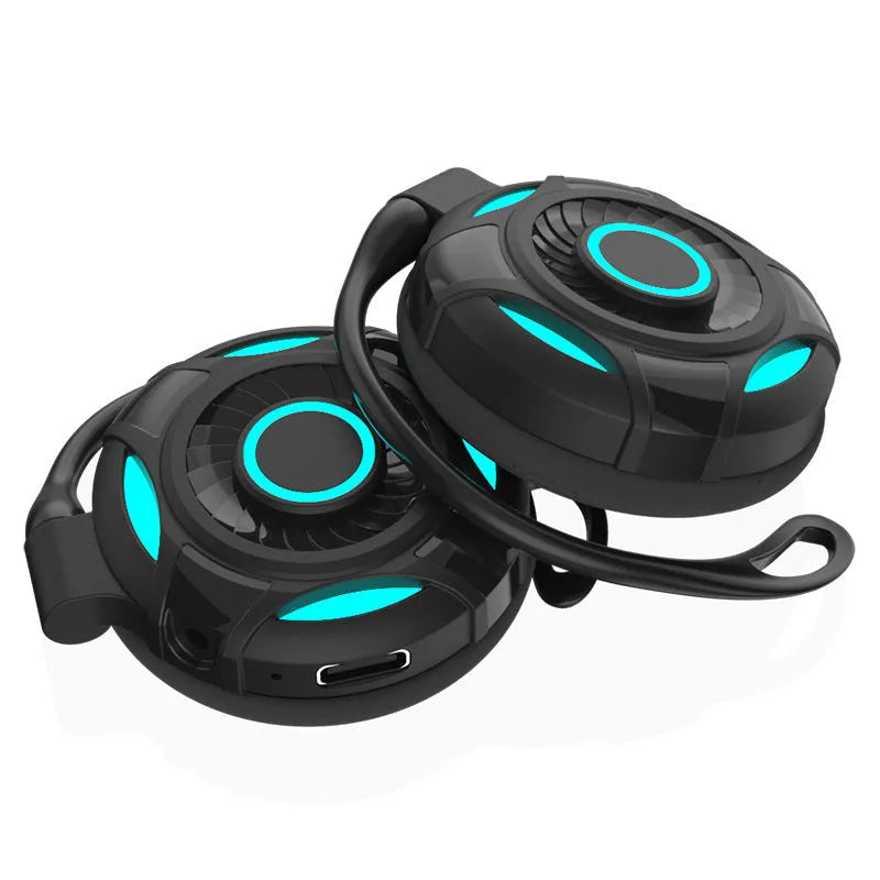Black and white wireless Bluetooth earphones with hanging ear design and USB charging