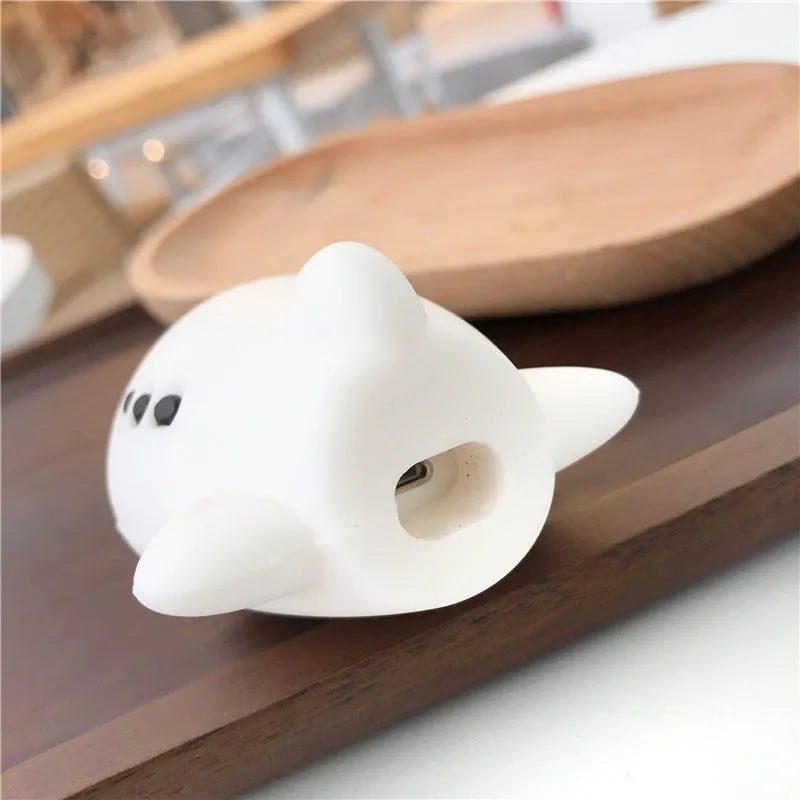 Silicone protective case for Apple AirPods with flip-top cover, cartoon aeroplane headset design, and detachable hook.