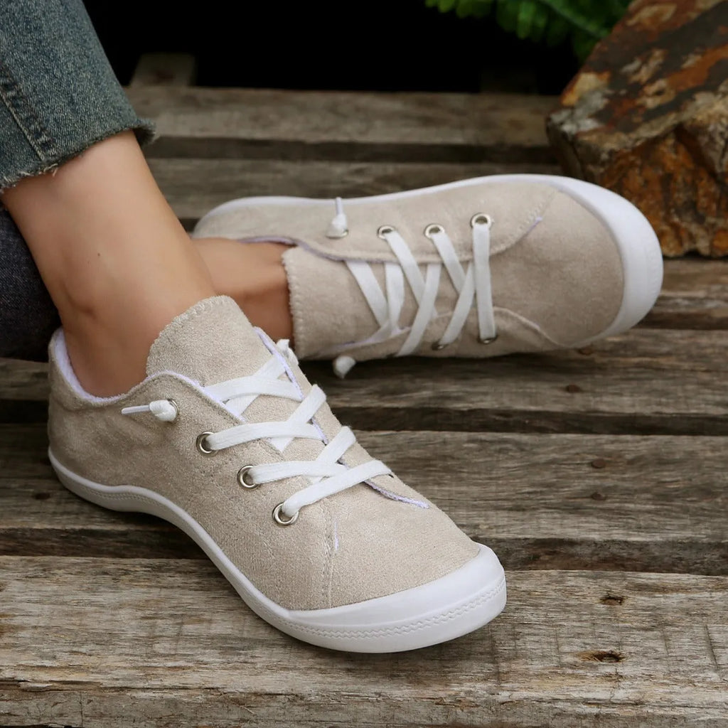 Women's creamy white low-top fabric casual sneaker on a wear-resistant rubber sole