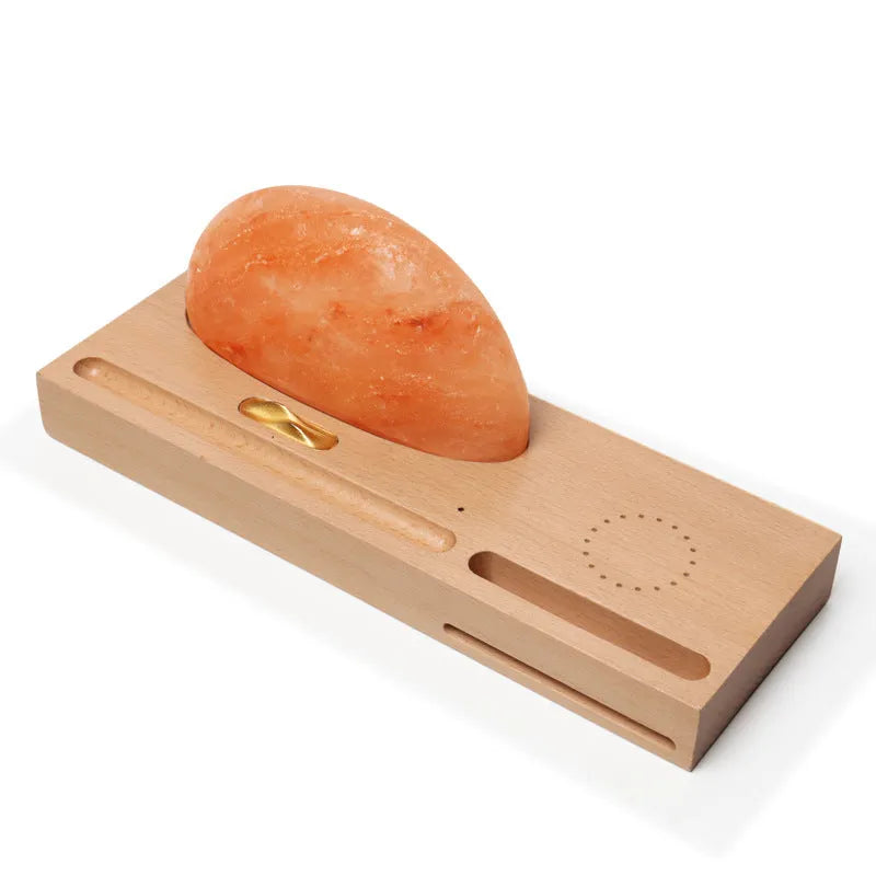 Sunrise Oriental wooden base table lamp with natural salt block shade and integrated wireless phone charging pad.