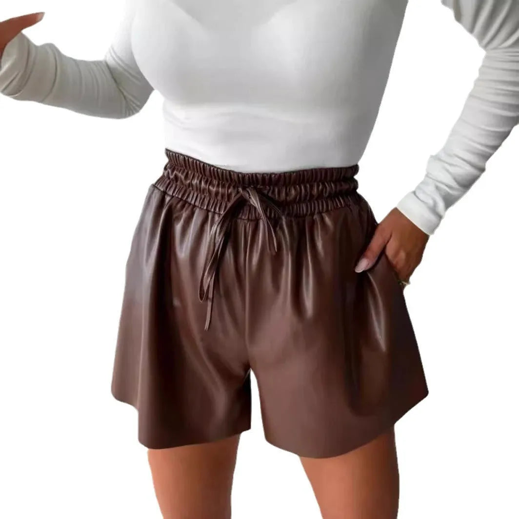 Women's black wide-leg shorts with lace-up drawstring waist detail and straight-leg silhouette
