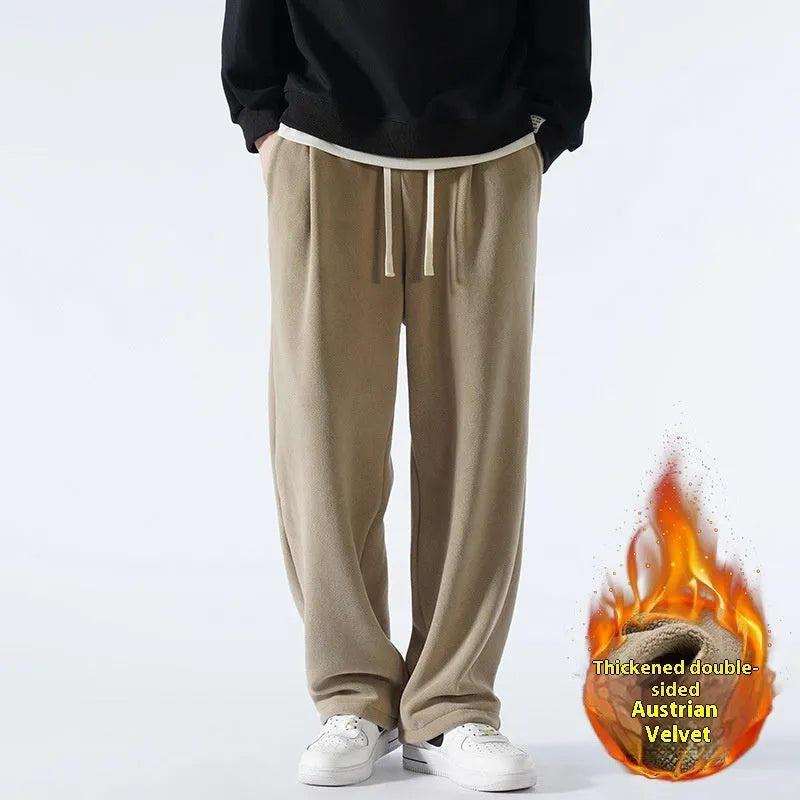 Men's apricot coloured loose-fit polar fleece trousers with a thick lining and drawstring waist.