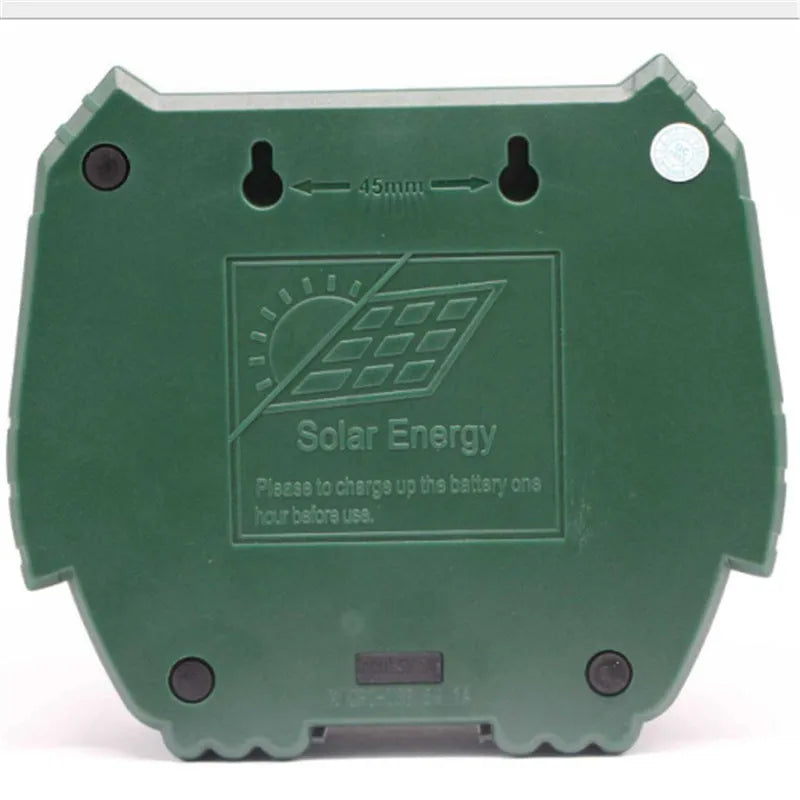 Green solar-powered ultrasonic dog and pest repeller unit for outdoor mounting