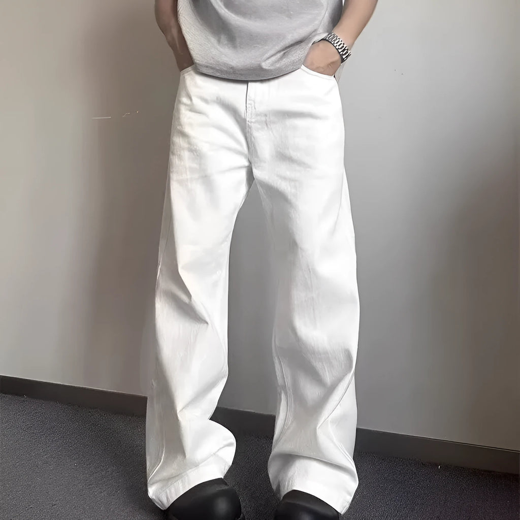 Men's white straight-leg cotton denim jeans on a hanger, showing front view with zipper fly.