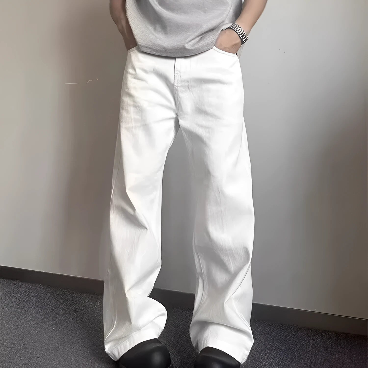 Men's white straight-leg cotton denim jeans on a hanger, showing front view with zipper fly.