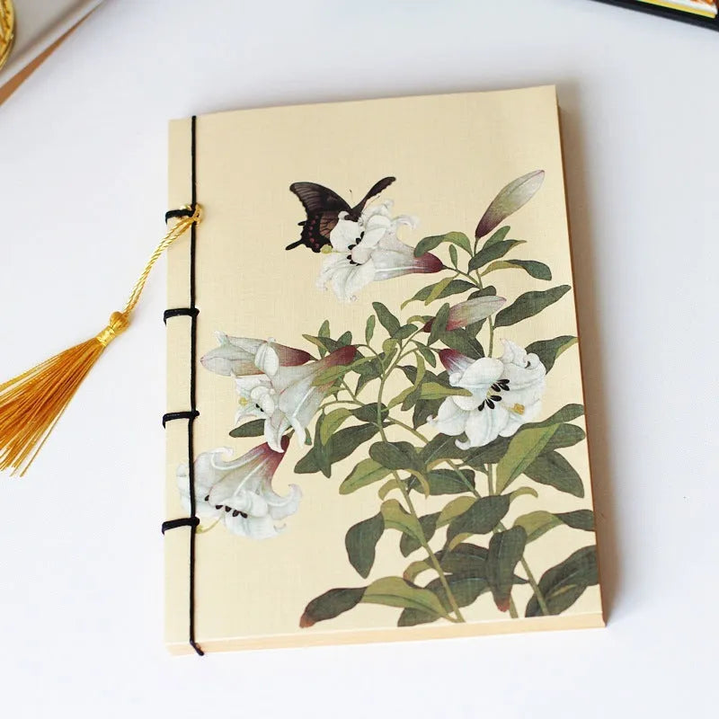 Antique wire-bound notebook with embossed cowhide cover and black wax rope binding