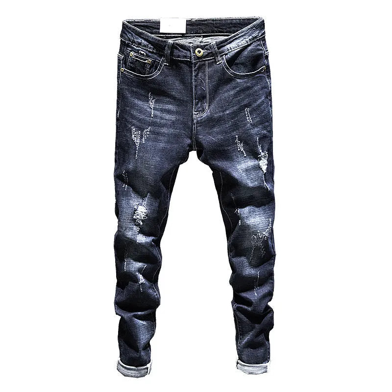 Men's dark blue skinny jeans with a slim fit and mid waist, laid flat.