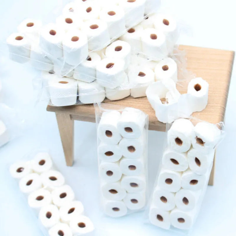 Miniature paper tissue roll model for dollhouse play measuring 30x15x80mm