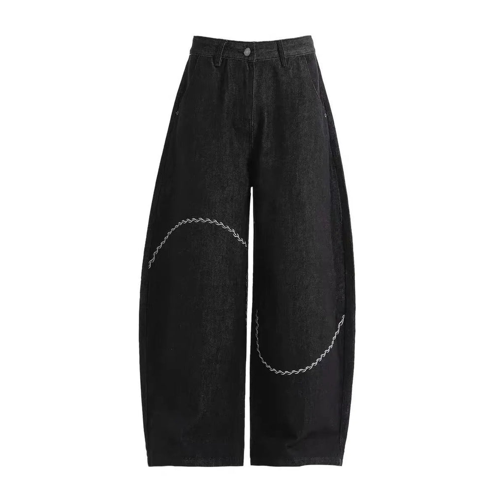 Black straight-leg denim trousers with mid-waist and zip fly for autumn winter wear