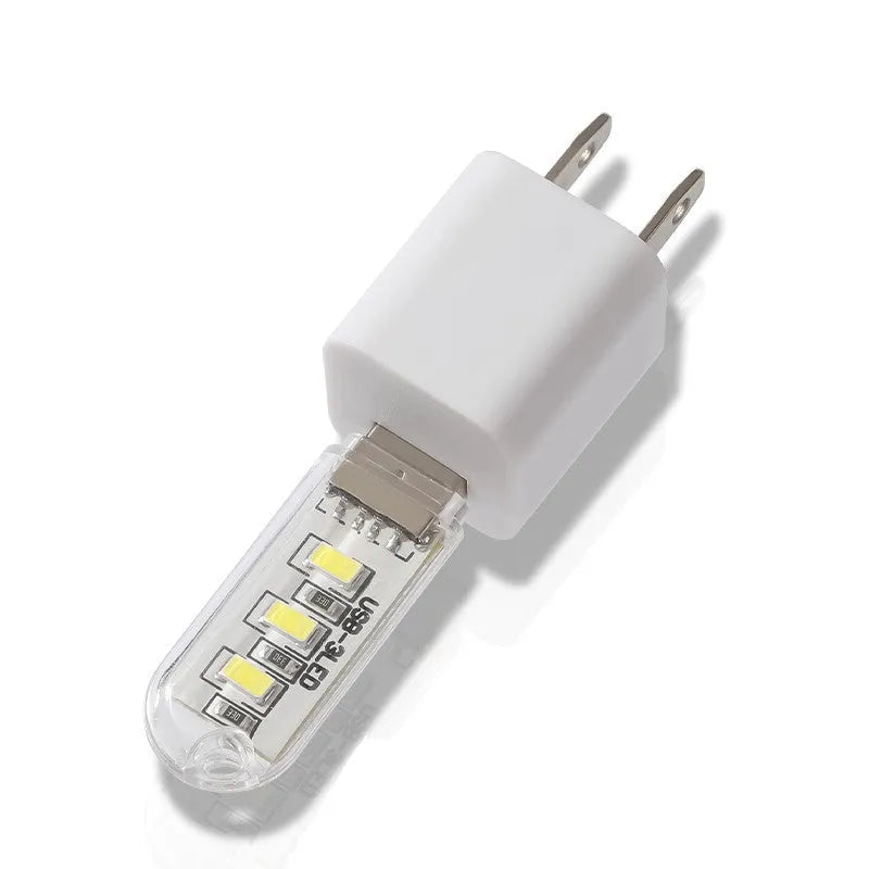 Small white USB rechargeable baby night light showing white and warm light glow options.