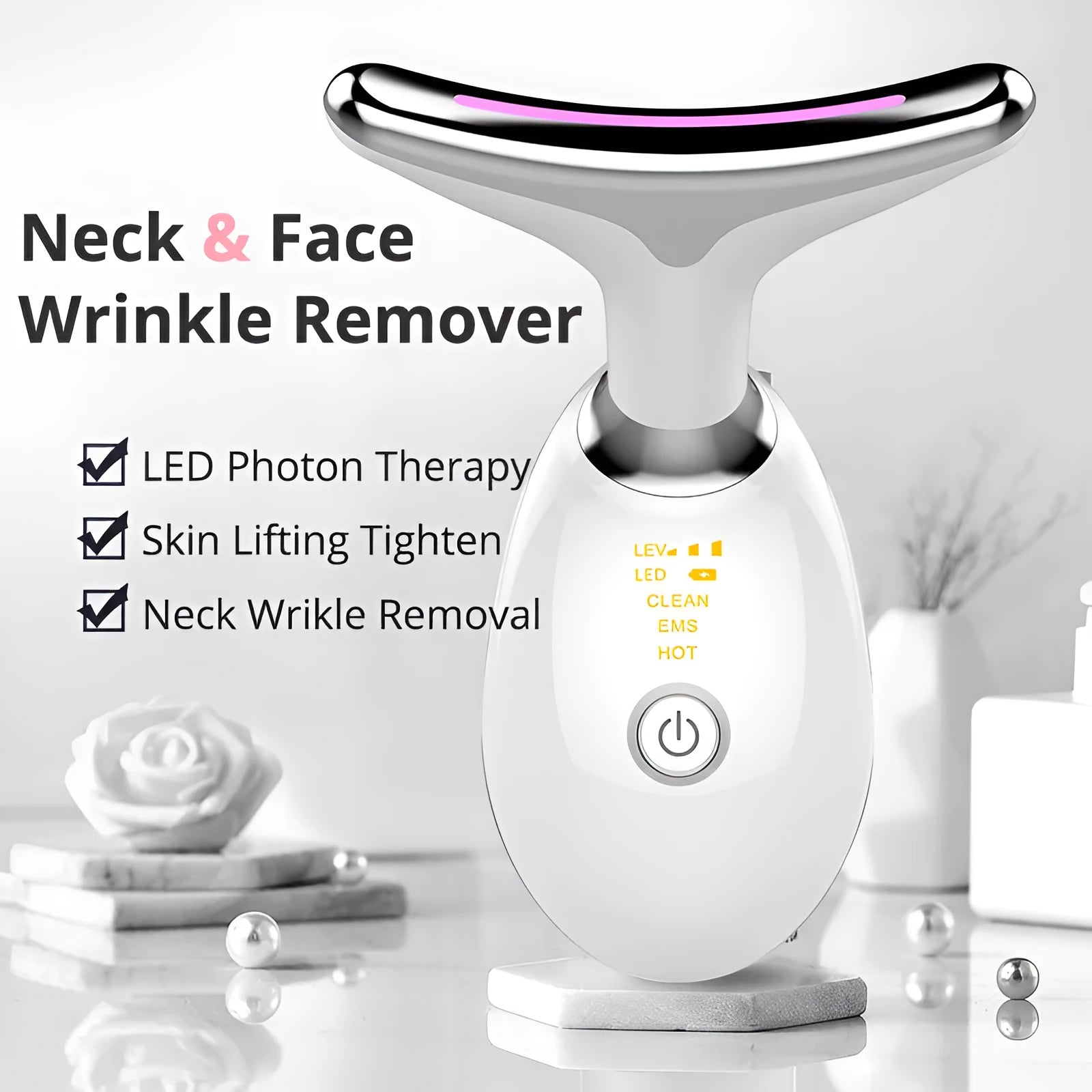 White EMS thermal neck massager device with LED lights on a stand next to USB cable.