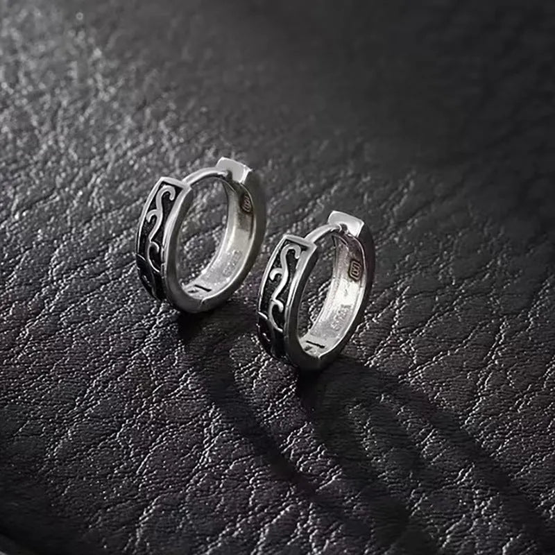 Men's geometric copper stud earrings in 10mm and 14mm sizes on a plain background.