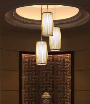 A woven bamboo plait lamp, 35cm tall, for hallway or staircase decoration