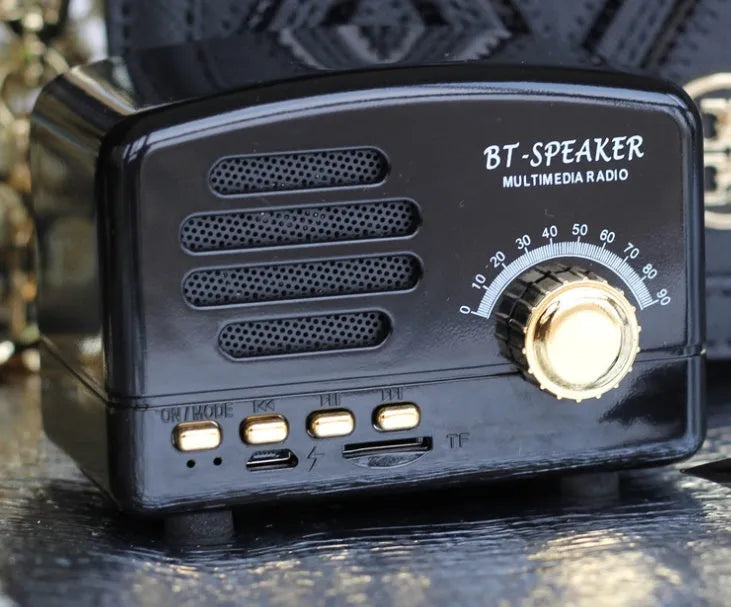 Vintage-style wood grain Bluetooth speaker in compact size with black and pink colour options