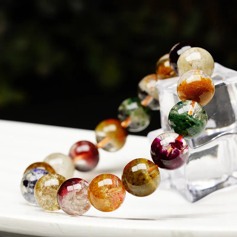 Natural crystal bracelet with colourful ghost cornucopia ethnic design featuring 10mm spherical beads
