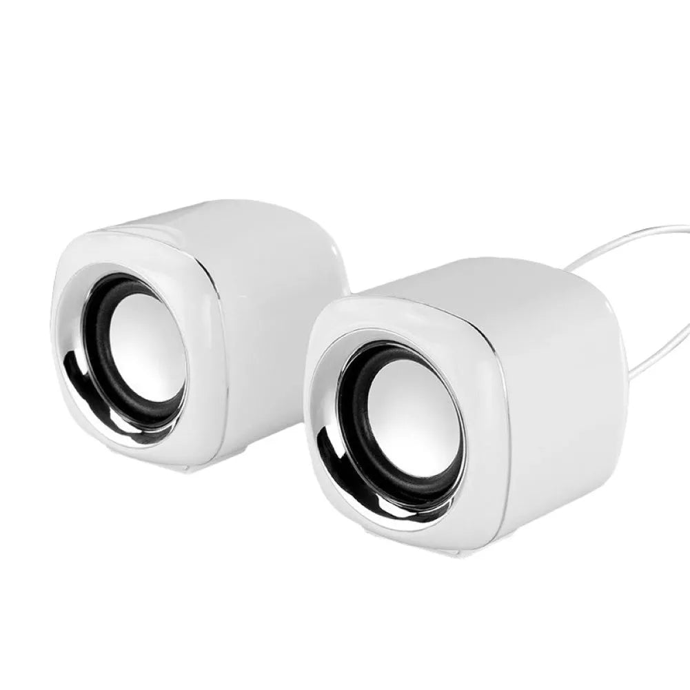 Pair of compact black wired computer speakers with 3.5mm plug showing 7.2cm cube dimensions