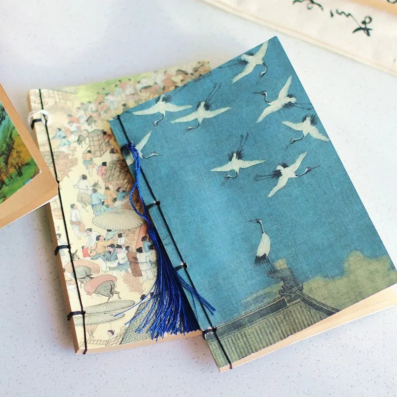 Antique wire-bound notebook with embossed cowhide cover and black wax rope binding