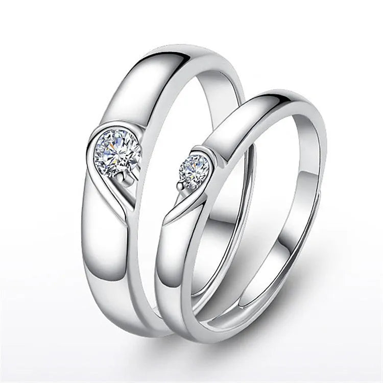 Heart-shaped diamond ring on finger, copper electroplate finish, couples wedding engagement style