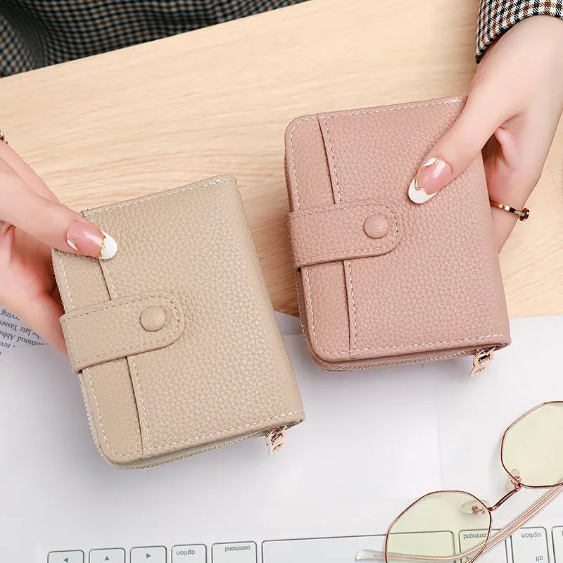 Ladies short fold wallet with lychee pattern in beige, pink, black, and red colours