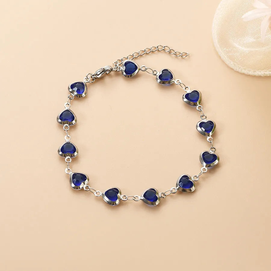 Devil's Eye Creative All-match Fashion Heart Bracelet in stainless steel on a wrist.