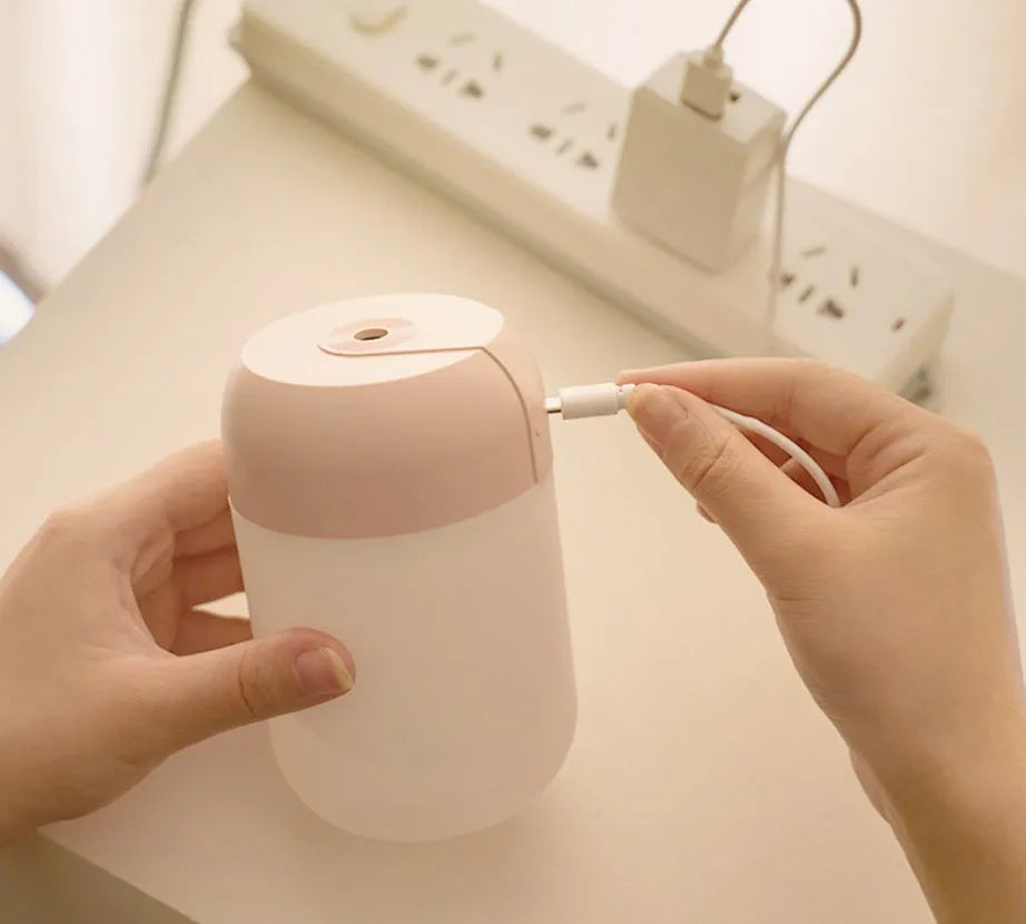 Small white cylindrical USB-powered humidifier with aromatherapy function