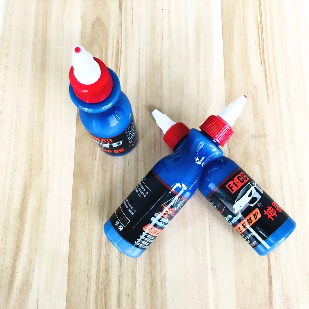 Small blue car wiping tool and 60ml bottle of blue scratch repair agent for vehicles.