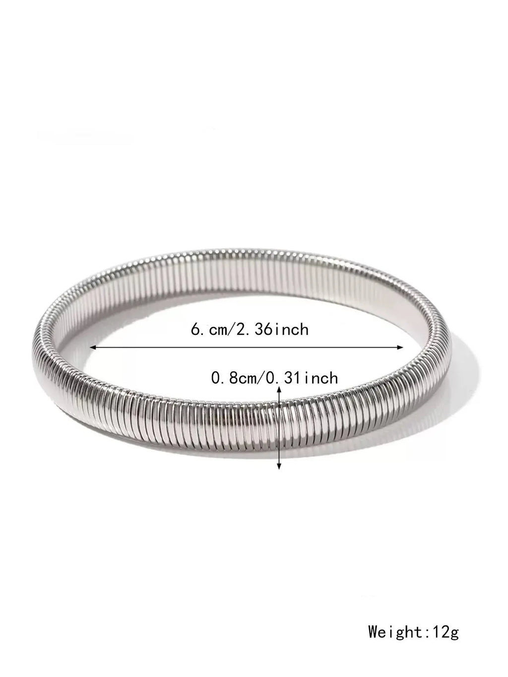 Gold titanium steel bracelet with wide vertical stripe ring pattern and elastic band on a wrist.