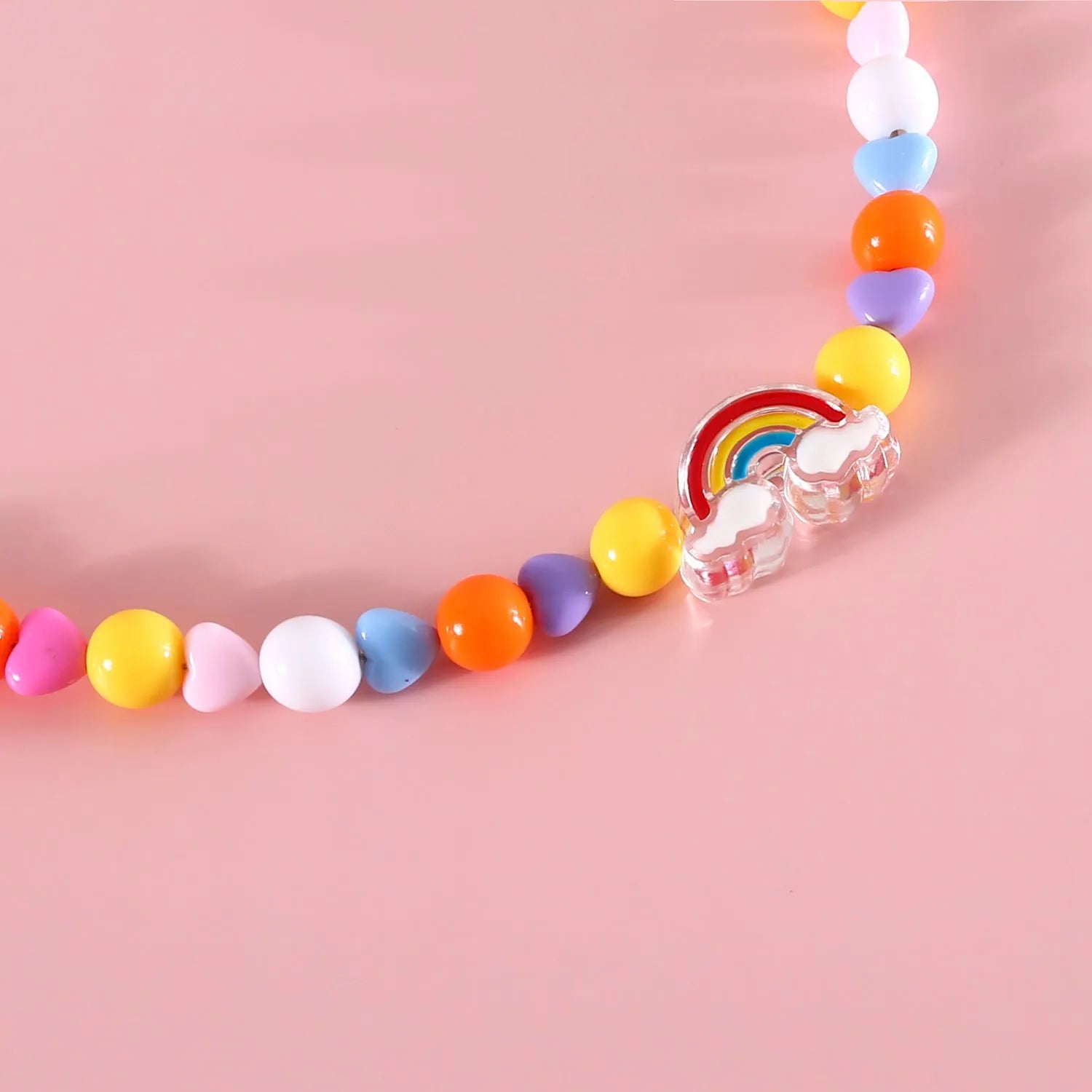 Colourful plastic bead pet necklace for a cat or dog in peach, rainbow, or small flower pattern.