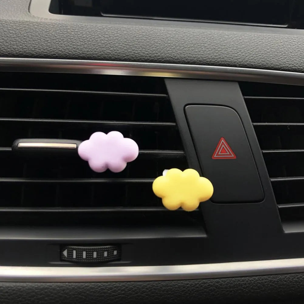 Resin Baiyun cartoon car fragrance clip for air vents in light green colour.