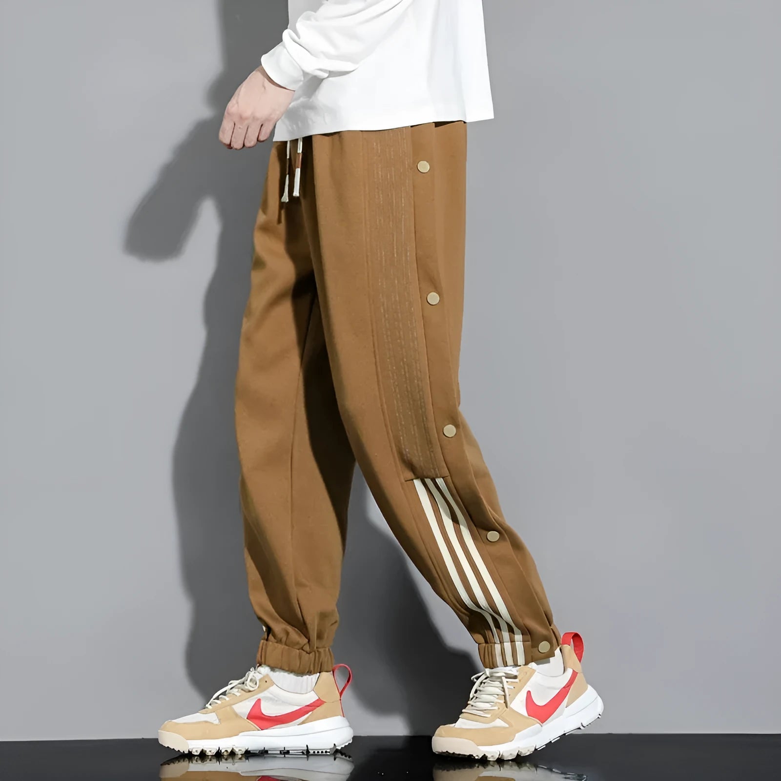Men's loose fit cotton blend sweatpants with ankle ties and drawstring waistband in black colour