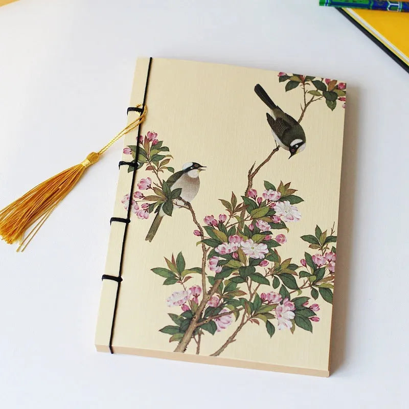 Antique wire-bound notebook with embossed cowhide cover and black wax rope binding