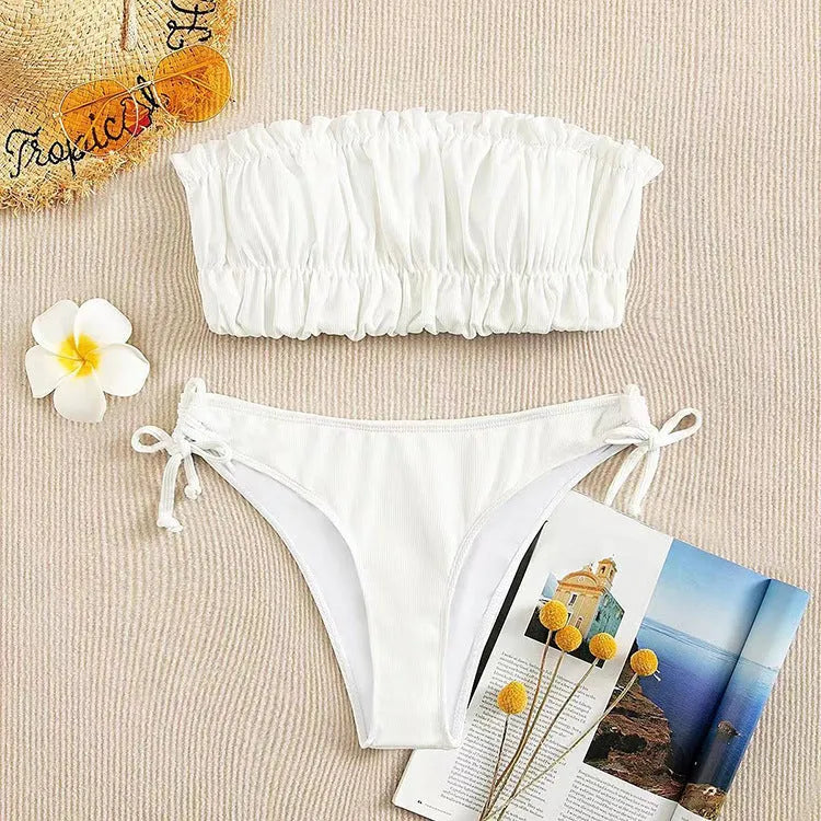 Women's solid colour polyester bikini set in black with chest pad, front view on model