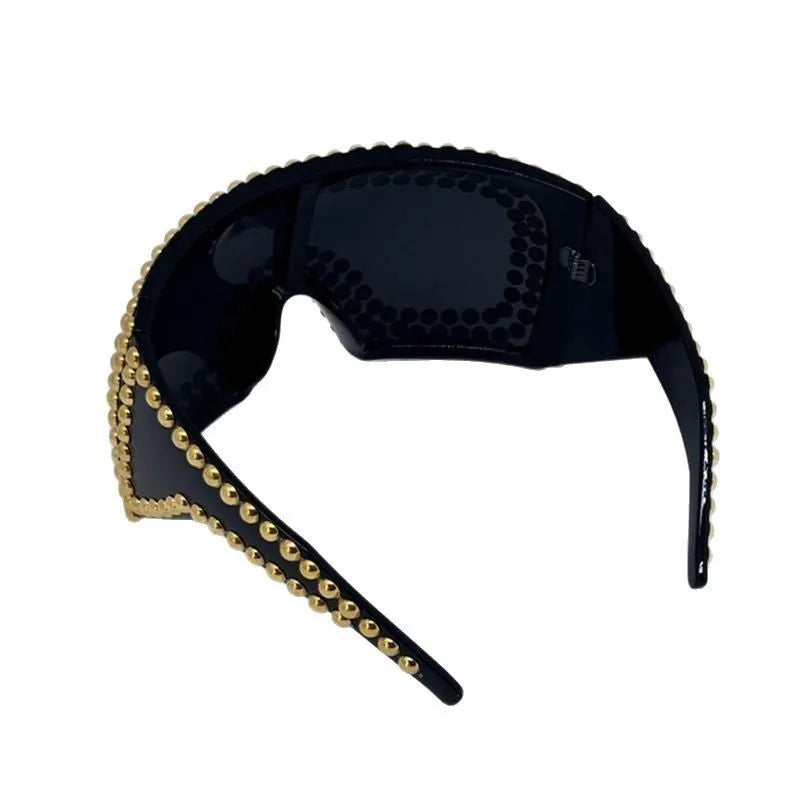 Men's punk style sunglasses with super large square rims and rivet detailing in gold colour