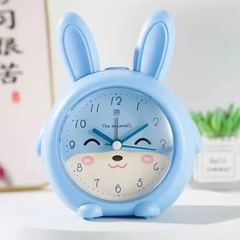 Cartoon style children's alarm clock with night light in blue or pink colour options