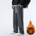 Men's apricot coloured loose-fit polar fleece trousers with a thick lining and drawstring waist.