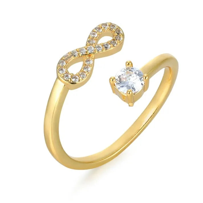 Personalised open geometric ring with inlaid zircon stones and an engraved letter, shown in gold, rose gold, and silver colour options.