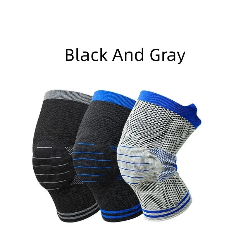 Silicone massage spring bar shock absorber knee pad in black and blue colour, shown with cotton material and sizing tag.