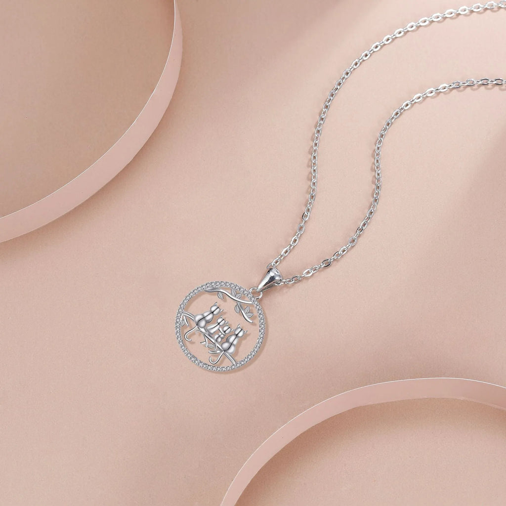 Four Kitten Necklace with cat motif pendant on cross chain